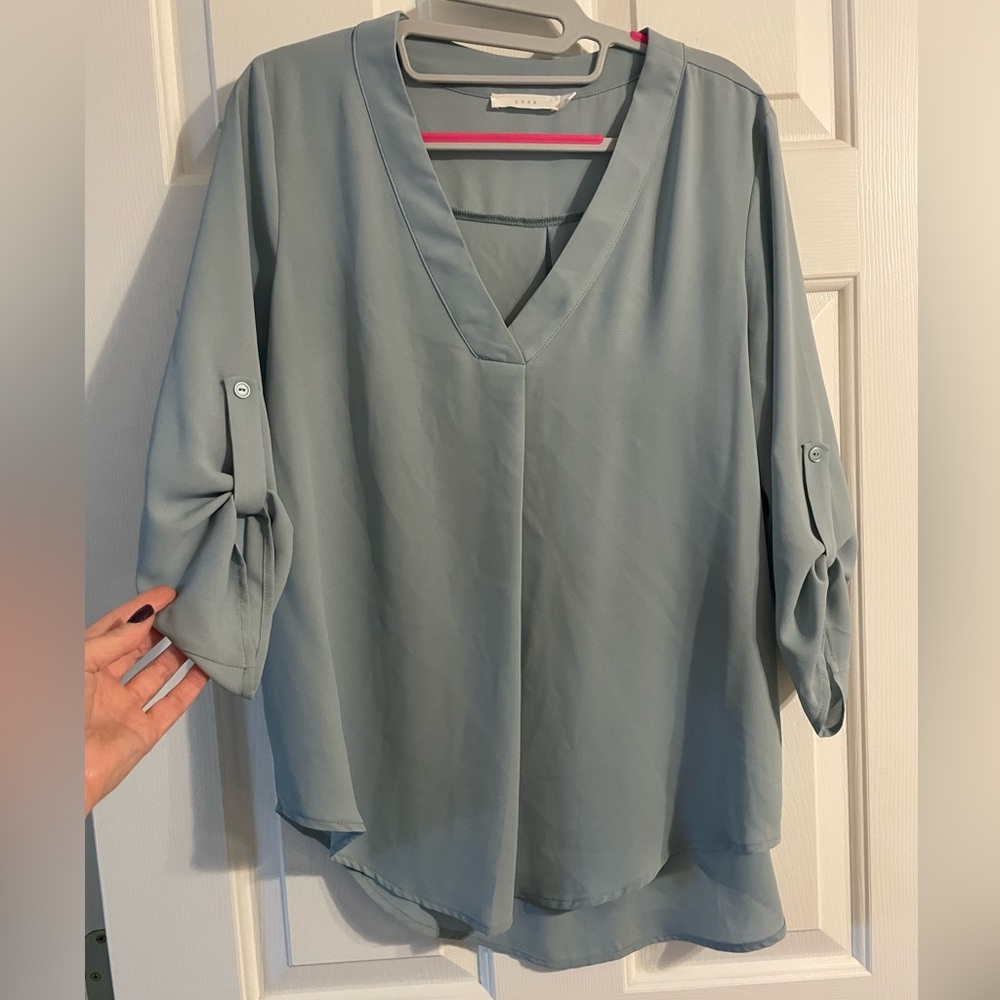 Medium weight blouse. I’m a size 6 and 5’4”.